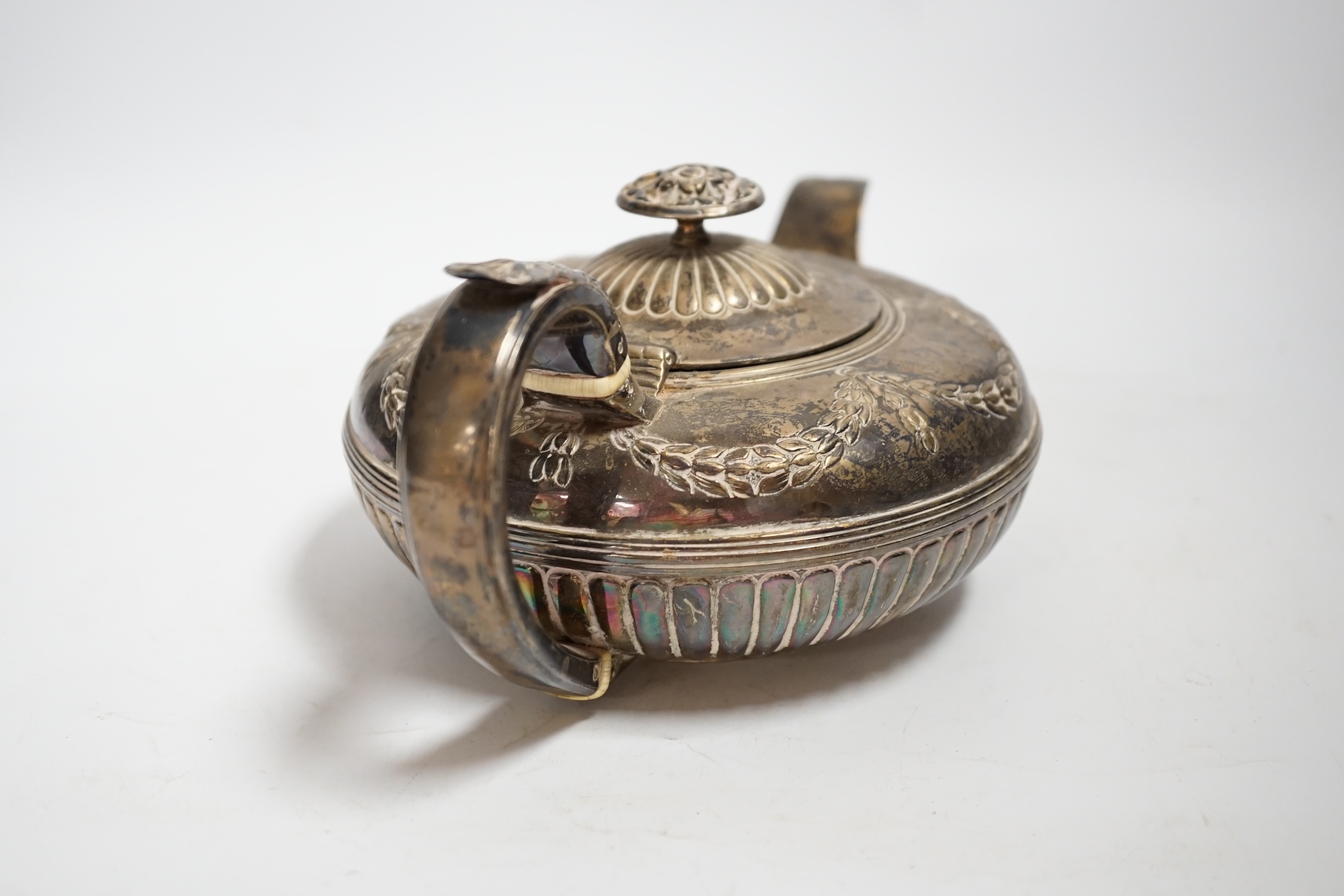 A George IV demi fluted silver squat circular teapot, Samuel Dutton?, London, 1826, gross weight 16.5oz CITES Submission reference A2RQDE6S